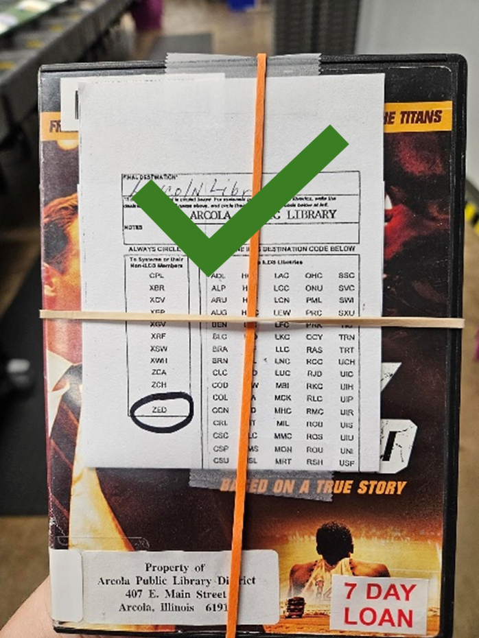 A book with a damage form covering the outside barcode.