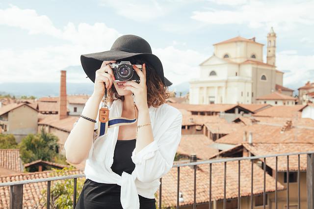  woman pointed a camera directly at the viewer