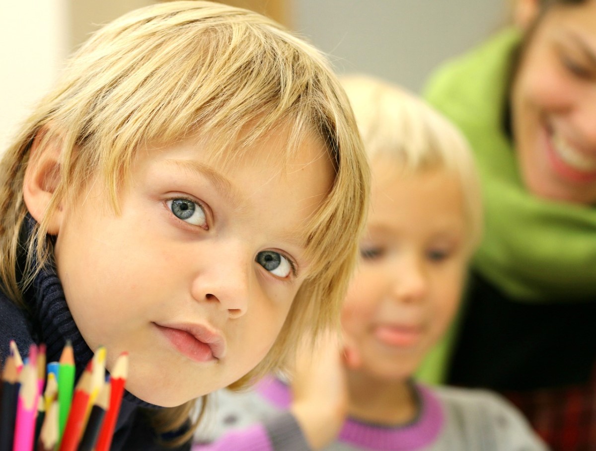 young school children looking at the camera