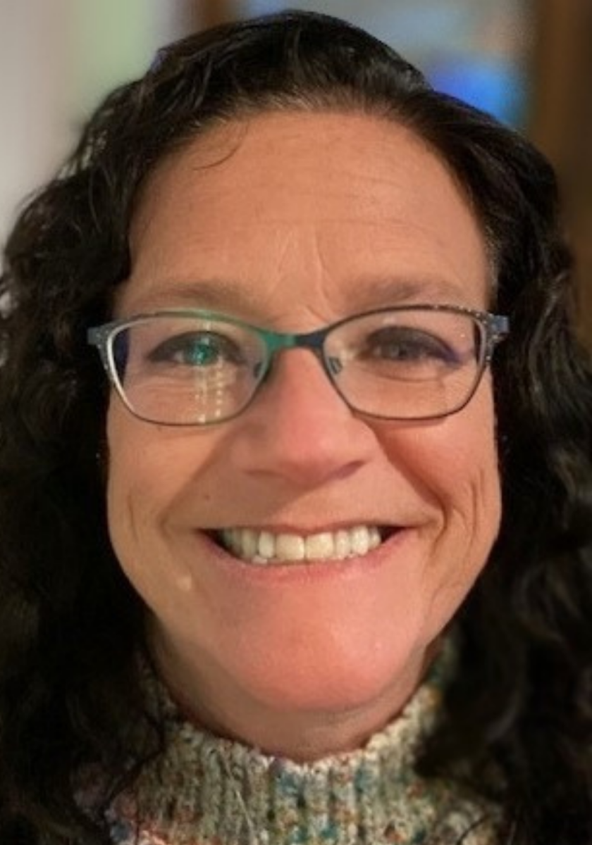 Barbera Scoby headshot. A white woman with brown hair and glasses.