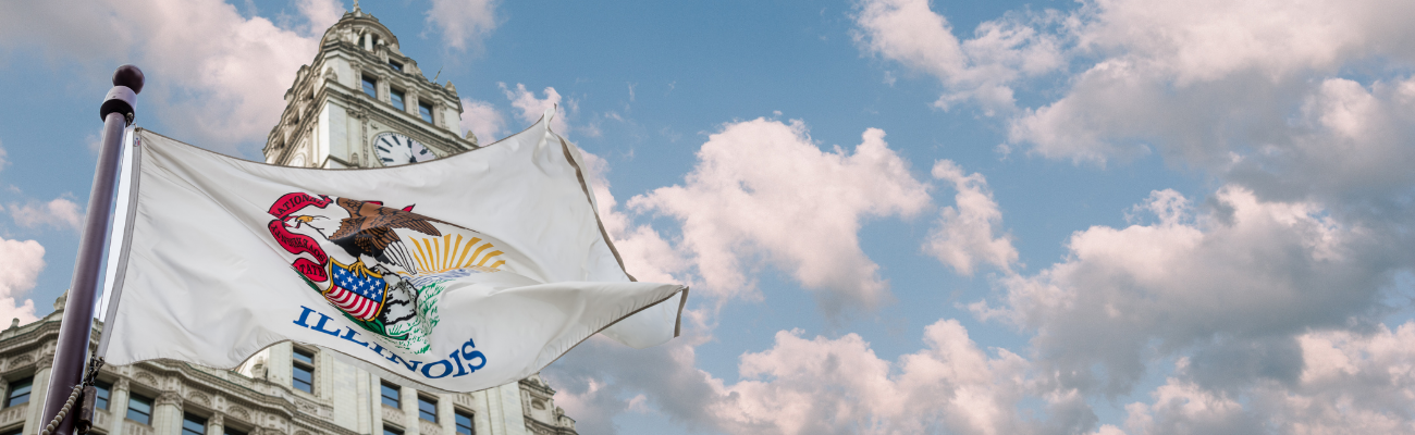 Photograph of Illinios flag flying in front of the Illinois Capitol building